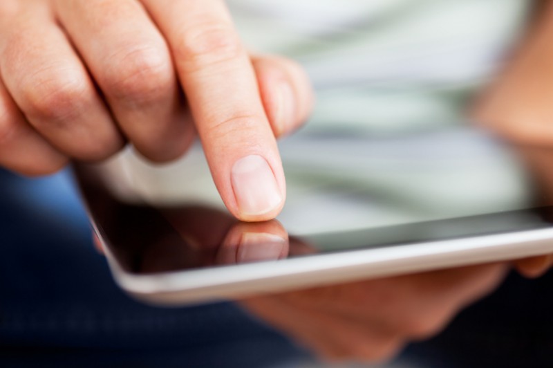 finger on tablet
